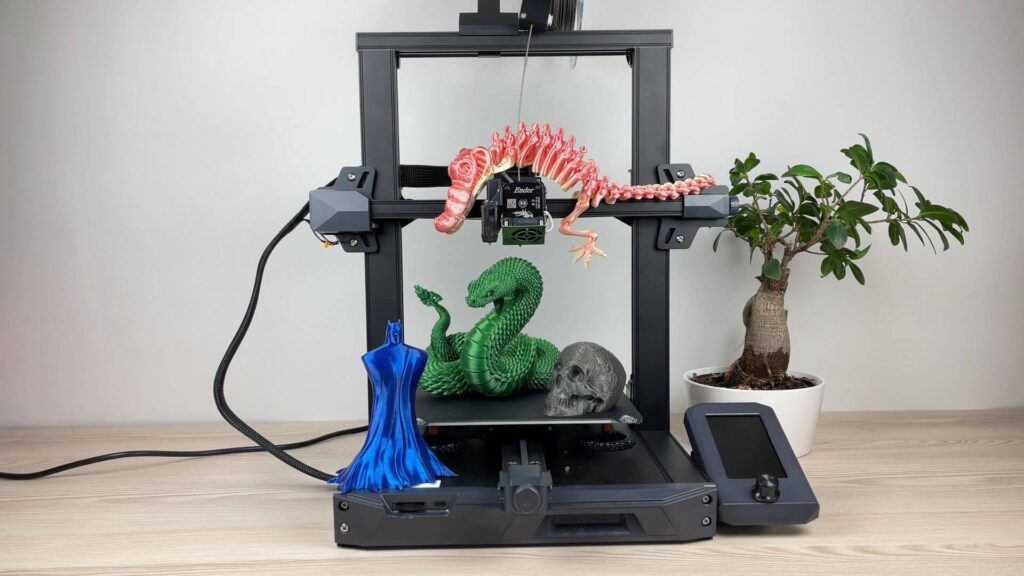 Impresora 3d construyendo figuras de dinosaurio